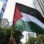 waving Palestinian flag in India